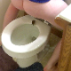 A girl straddles a toilet and takes a hard, chunky shit and piss. Some big splashes are seen at the turds hit the water. Product shown in the bowl. Presented in 720P HD. Over 3 minutes.